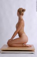 Photo Reference of betty kneeling pose 09