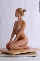 Photo Reference of betty kneeling pose 10