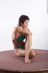 Swimsuit Woman White Sitting poses - ALL Muscular short brown Sitting poses - simple Academic